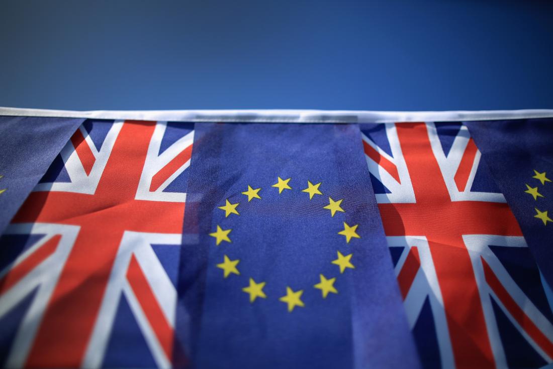 In this photo illustration the European Union and the Union flag sit together on bunting on March 17, 2016 in Knutsford, United Kingdom. The United Kingdom will hold a referendum on June 23, 2016 to decide whether or not to remain a member of the European Union (EU), an economic and political partnership involving 28 European countries which allows members to trade together in a single market and free movement across it's borders for cirtizens.
